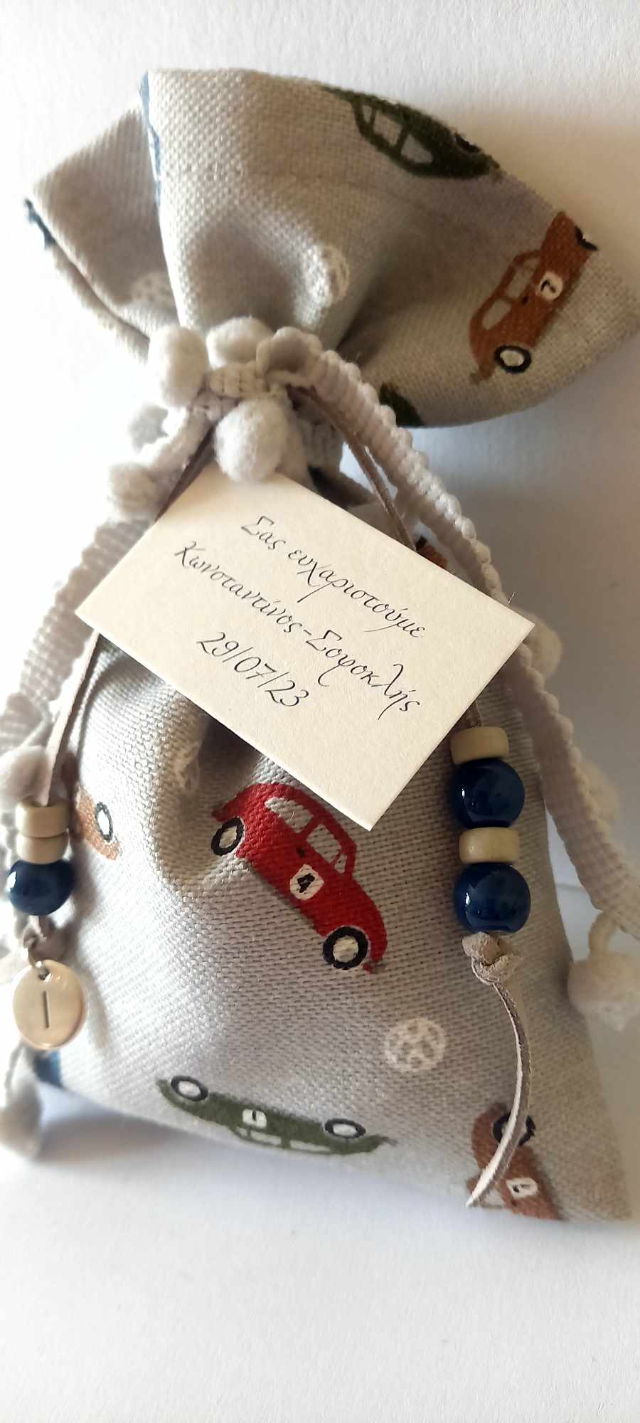 Μπομπονιέρα βάπτισης πουγκί με διακοσμητικό μπεγλέρι