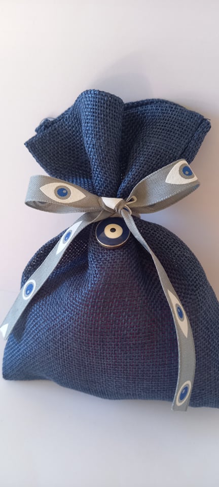 Μπομπονιέρα βάπτισης λινό πουγκί με κορδέλα και μάτι