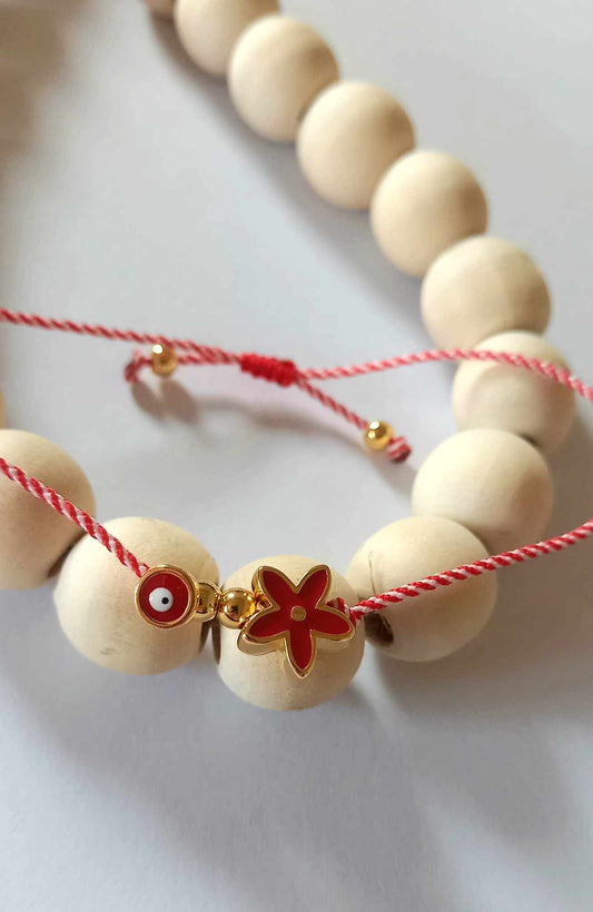 Χειροποίητο βραχιόλι μαρτάκι με επιχρυσωμένο λουλούδι και μάτι