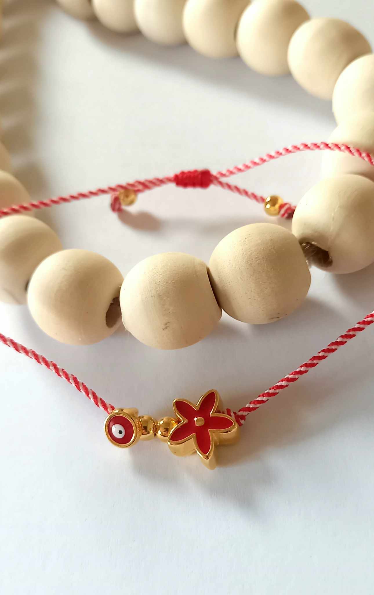 Χειροποίητο βραχιόλι μαρτάκι με επιχρυσωμένο λουλούδι και μάτι