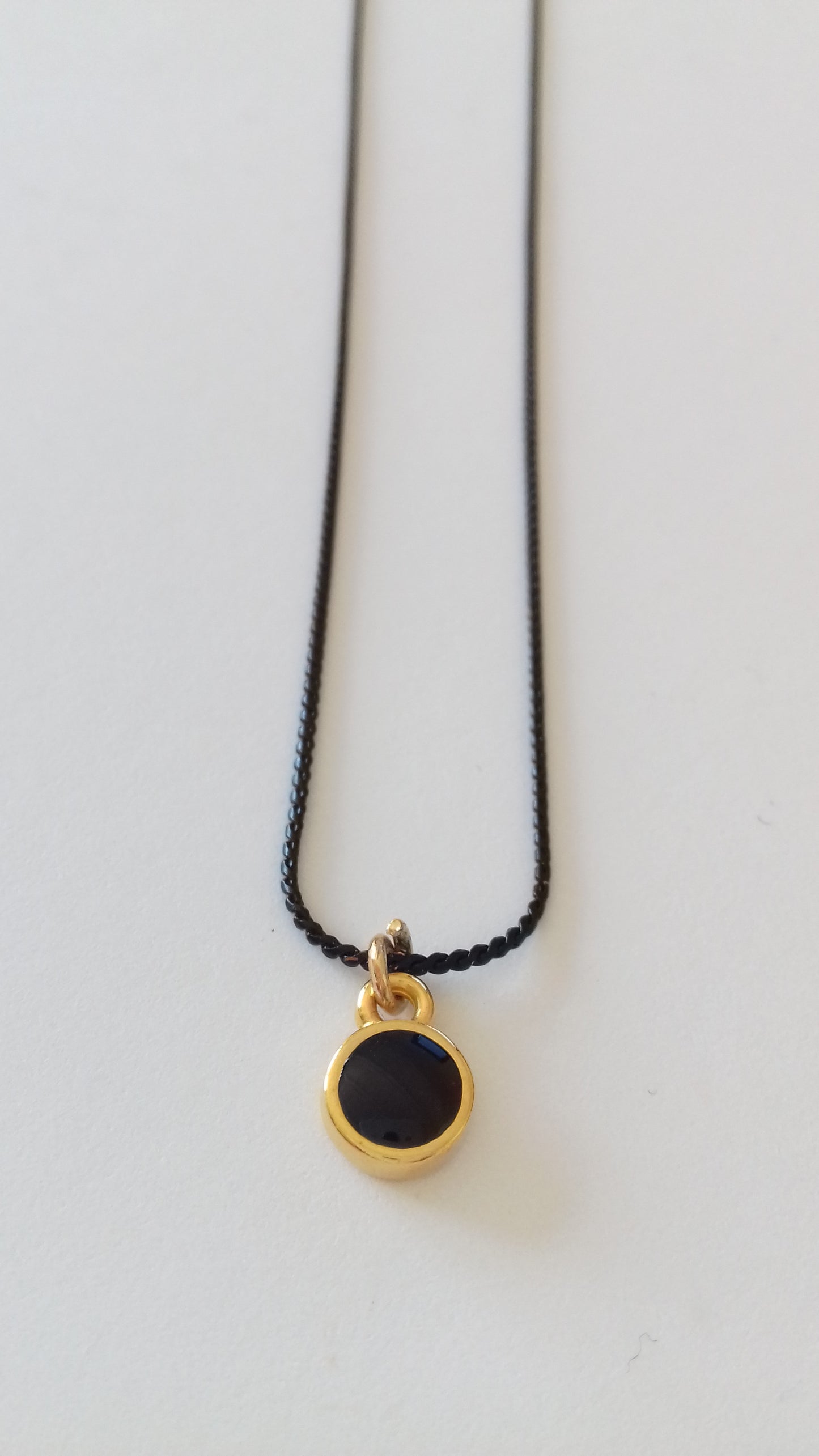 Tiny black enamel round pendant necklace