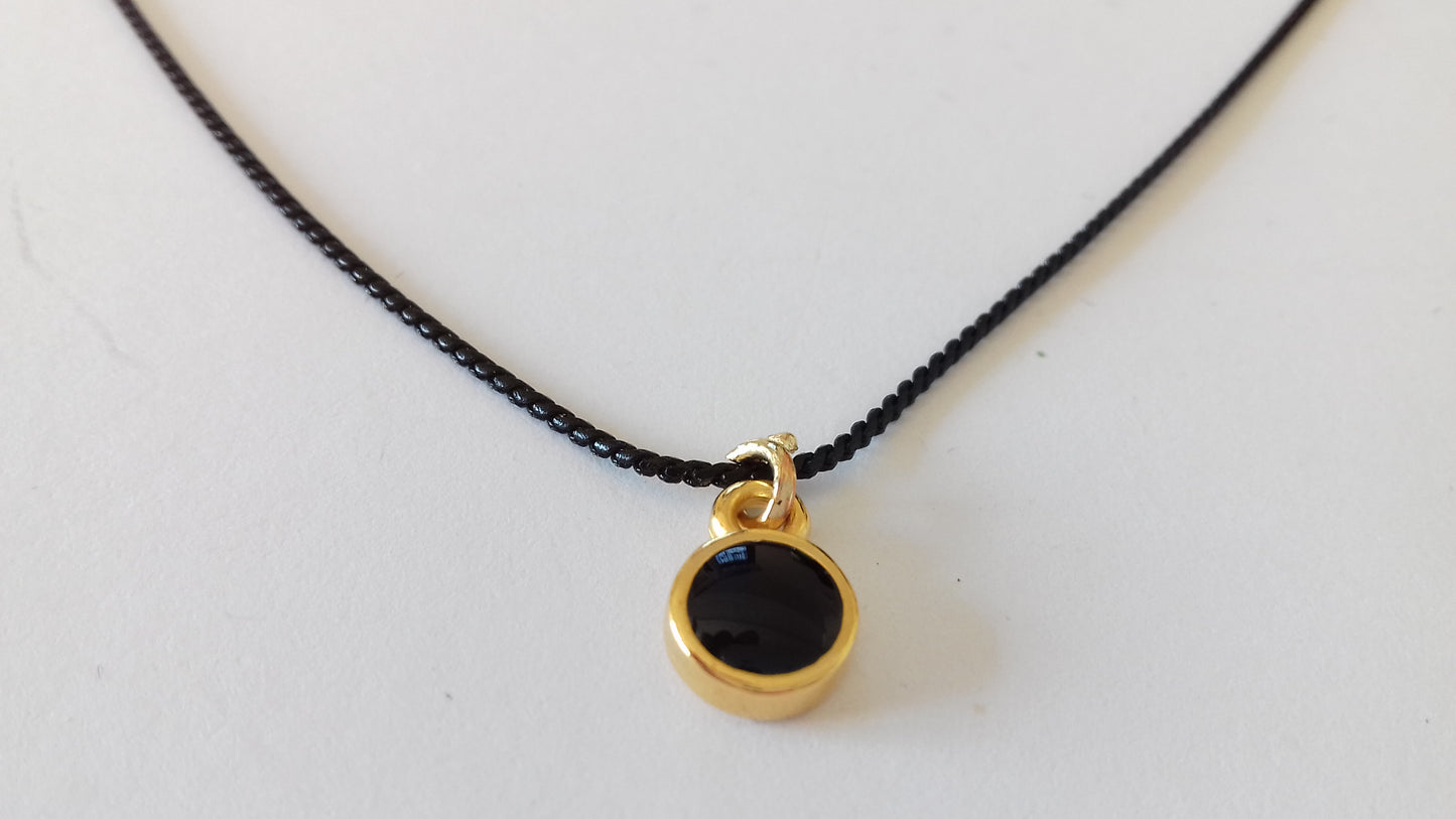 Tiny black enamel round pendant necklace