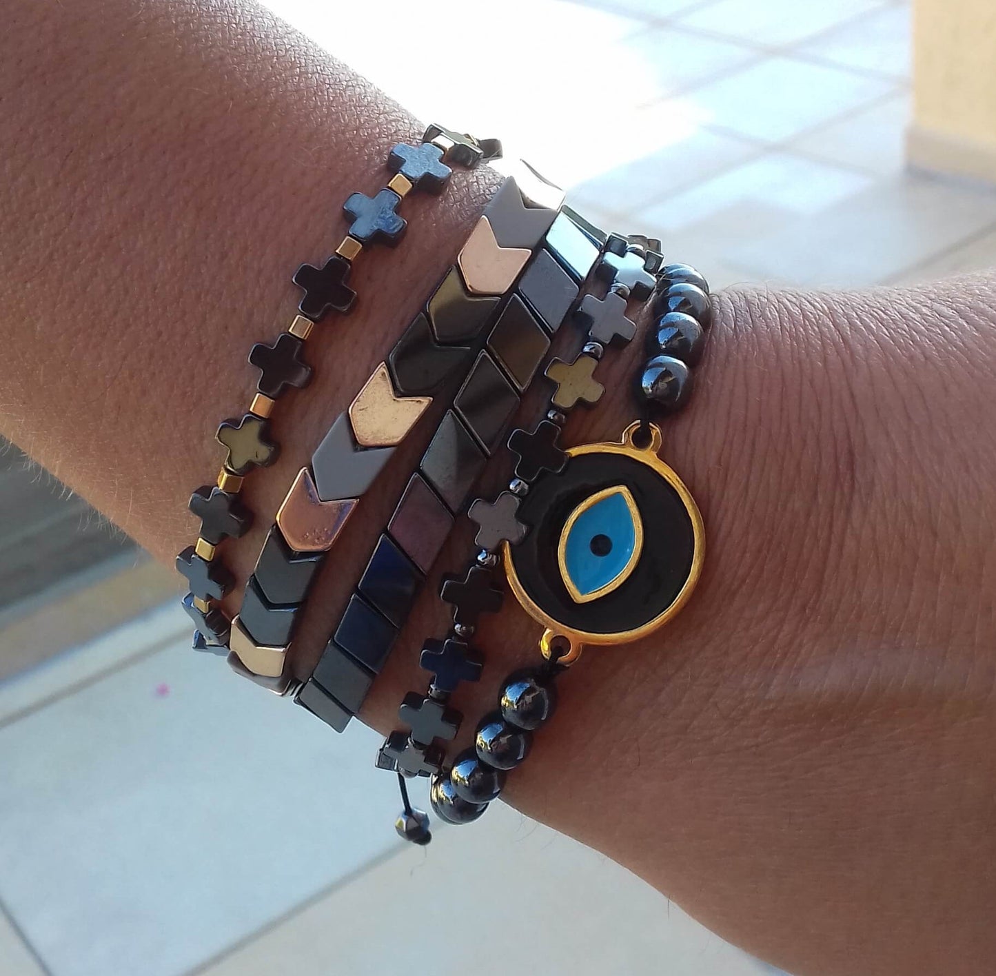 Hematite stones black enamel evil-eye macrame bracelet